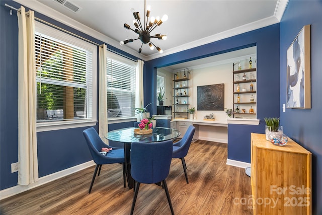 5088 Watersail Way, Clover, SC 29710 - dining room with a chandelier, wood finished floors, ornamental molding, and baseboards