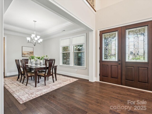 1008 Ladera Dr, Marvin, NC 28173 - entrance foyer featuring dark wood-style flooring, a chandelier, french doors, ornamental molding, and a raised ceiling