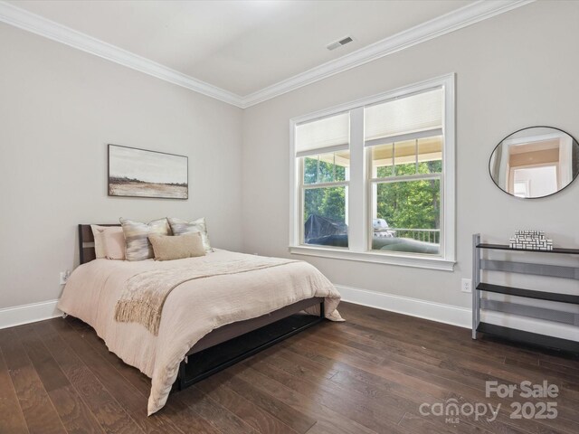 1008 Ladera Dr, Marvin, NC 28173 - bedroom featuring crown molding and dark wood-type flooring