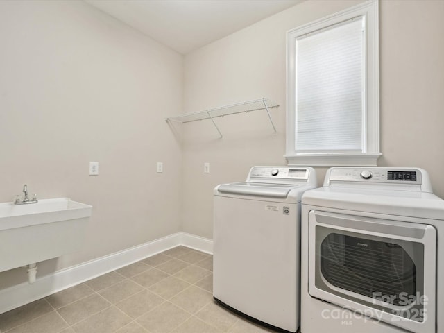 1008 Ladera Dr, Marvin, NC 28173 - washroom featuring washer and dryer and light tile patterned floors
