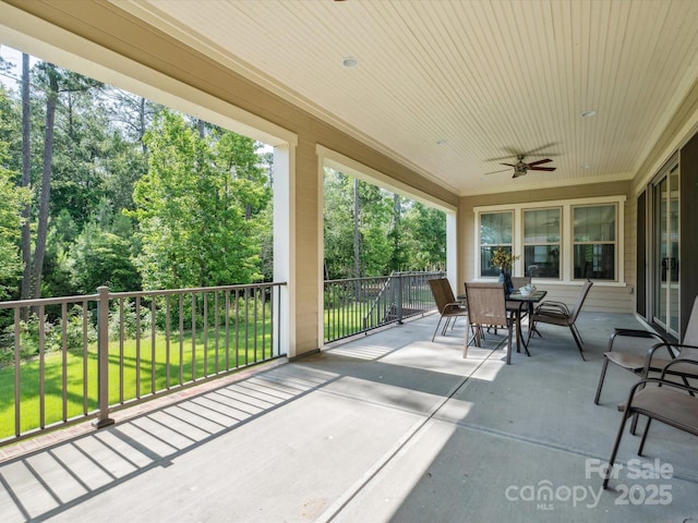 1008 Ladera Dr, Marvin, NC 28173 - view of patio / terrace with outdoor dining space, ceiling fan, and view of scattered trees