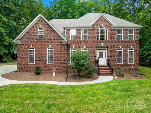 763 Evans Manor Dr, Weddington, NC 28104 - view of front facade with a front yard and brick siding