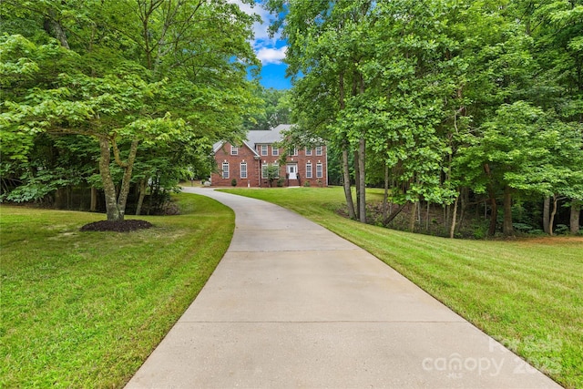 763 Evans Manor Dr, Weddington, NC 28104 - colonial inspired home featuring driveway, a front yard, and brick siding