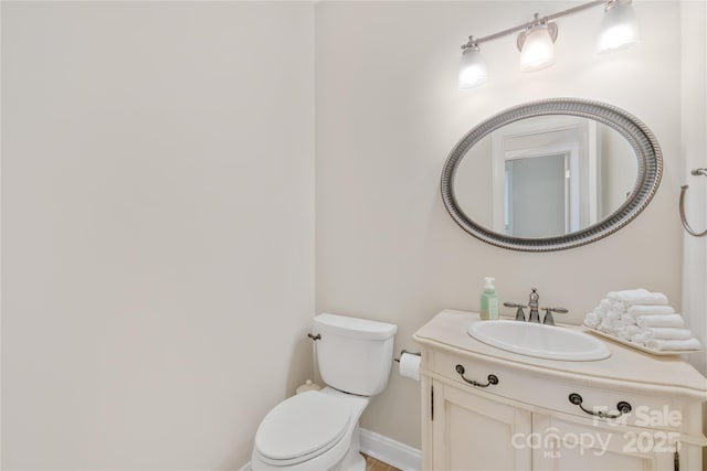 763 Evans Manor Dr, Weddington, NC 28104 - half bathroom featuring toilet, vanity, and baseboards