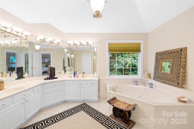763 Evans Manor Dr, Weddington, NC 28104 - bathroom with double vanity, tile patterned floors, and a bath