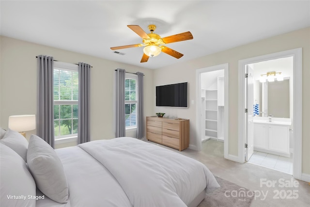 763 Evans Manor Dr, Weddington, NC 28104 - bedroom with a walk in closet, light colored carpet, baseboards, ensuite bathroom, and a ceiling fan