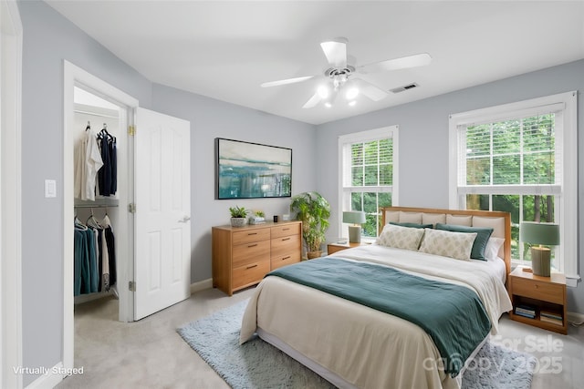 763 Evans Manor Dr, Weddington, NC 28104 - bedroom featuring a spacious closet, baseboards, light colored carpet, a closet, and a ceiling fan