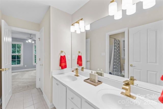 763 Evans Manor Dr, Weddington, NC 28104 - full bath with toilet, double vanity, tile patterned floors, and baseboards