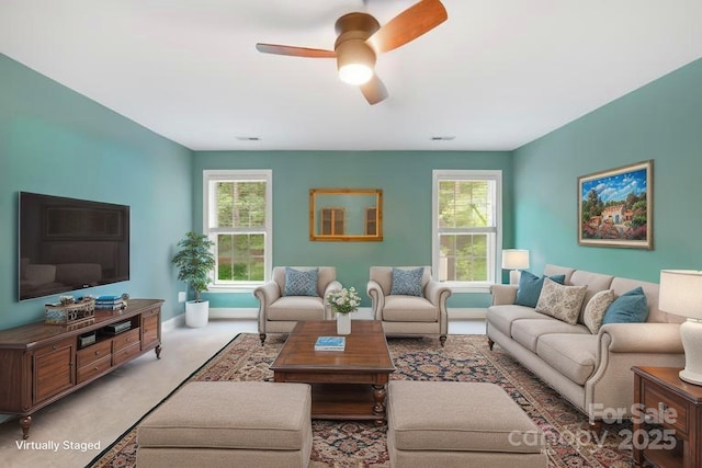 763 Evans Manor Dr, Weddington, NC 28104 - living room with plenty of natural light, ceiling fan, light colored carpet, and baseboards