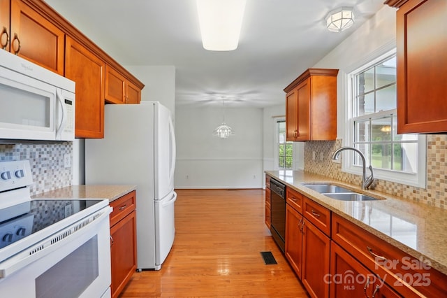 924 Secrest Hill Dr, Monroe, NC 28110 - kitchen with white appliances, a sink, decorative backsplash, and light wood-style floors