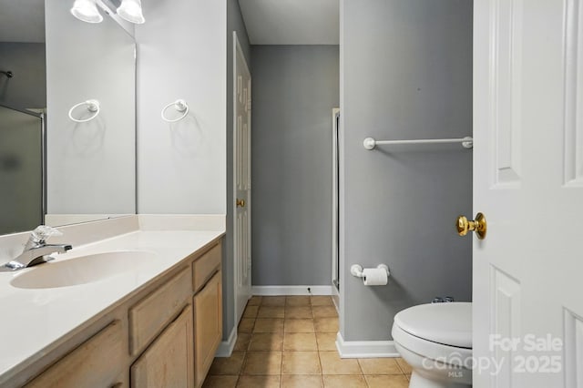 924 Secrest Hill Dr, Monroe, NC 28110 - bathroom with a stall shower, vanity, toilet, tile patterned floors, and baseboards