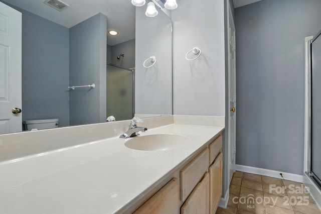 924 Secrest Hill Dr, Monroe, NC 28110 - bathroom with a shower with door, toilet, vanity, tile patterned floors, and baseboards