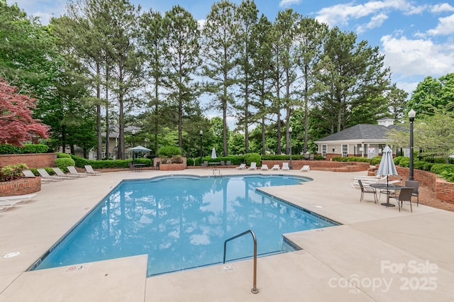 4124 Melrose Club Dr, Matthews, NC 28105 - community pool featuring a patio and view of scattered trees