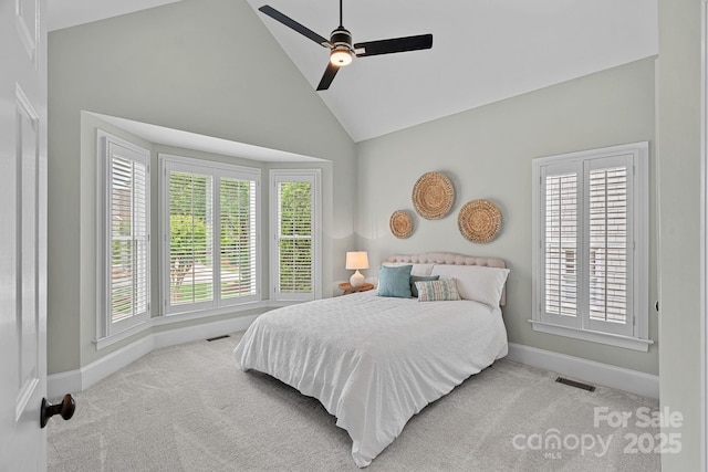 17308 Players Ridge Dr, Cornelius, NC 28031 - carpeted bedroom with baseboards, high vaulted ceiling, and a ceiling fan