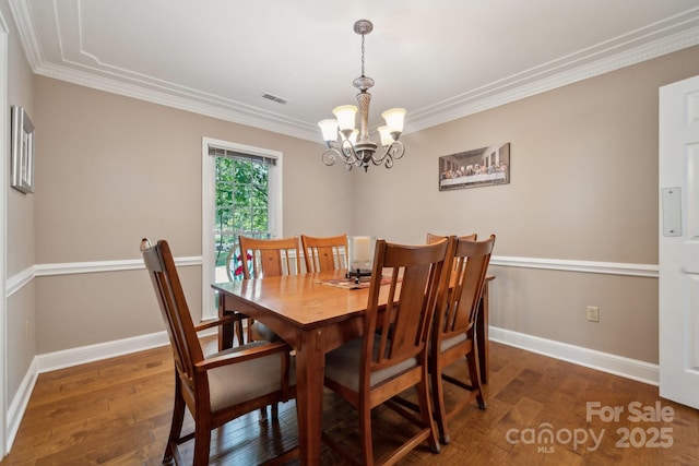 2234 Hamilton Mill Rd, Charlotte, NC 28270 - dining room with a chandelier, wood finished floors, crown molding, and baseboards