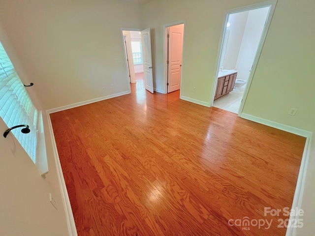 11624 Truan Ln, Cornelius, NC 28031 - unfurnished bedroom with light wood-style flooring, baseboards, and ensuite bath