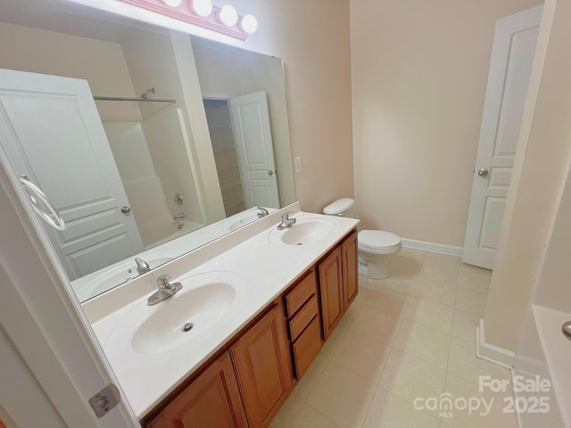 11624 Truan Ln, Cornelius, NC 28031 - full bathroom featuring baseboards, tile patterned floors, double vanity, toilet, and shower / bathtub combination