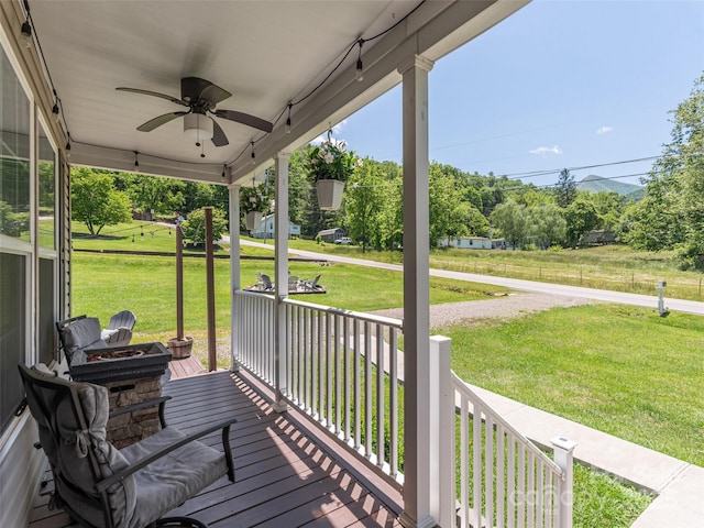 16 Sams Branch Rd, Candler, NC 28715 - wooden porch with a ceiling fan and a lawn