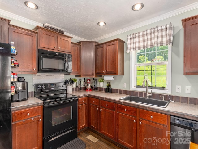 16 Sams Branch Rd, Candler, NC 28715 - kitchen with black appliances, a sink, crown molding, tile countertops, and dark wood-type flooring
