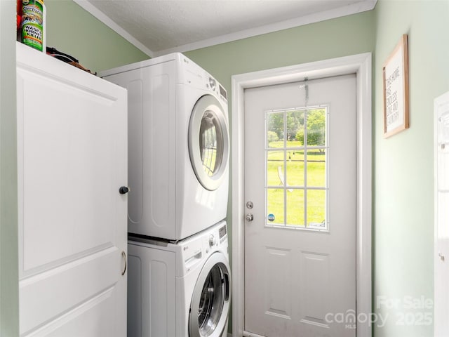 16 Sams Branch Rd, Candler, NC 28715 - laundry room with stacked washer / drying machine and ornamental molding