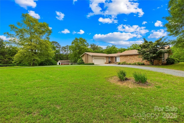 2309 Potter Rd S, Waxhaw, NC 28173 - view of front of house featuring driveway, an attached garage, and a front yard