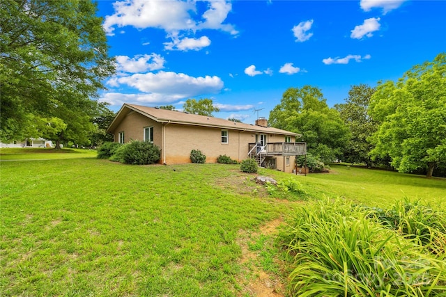 2309 Potter Rd S, Waxhaw, NC 28173 - view of home's exterior featuring a lawn, a wooden deck, and a chimney