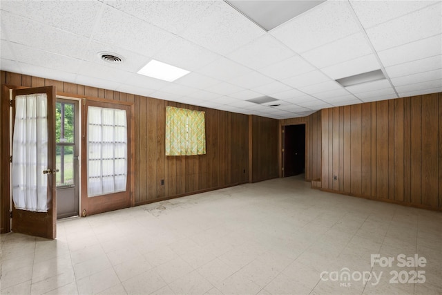 2309 Potter Rd S, Waxhaw, NC 28173 - unfurnished room with light floors, wooden walls, and a drop ceiling