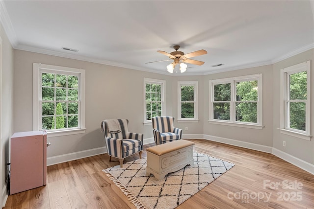 2006 Sandy Pond Ln, Waxhaw, NC 28173 - sitting room featuring crown molding, light wood finished floors, baseboards, and ceiling fan