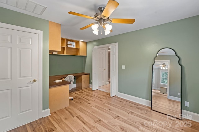 2006 Sandy Pond Ln, Waxhaw, NC 28173 - unfurnished bedroom featuring light wood-style floors, baseboards, an office area, and a ceiling fan