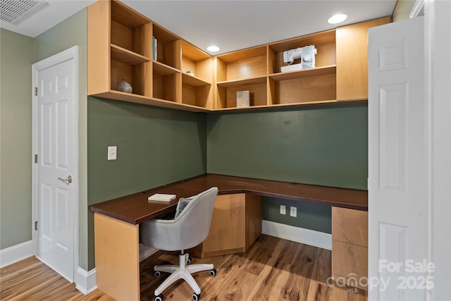 2006 Sandy Pond Ln, Waxhaw, NC 28173 - unfurnished office featuring built in study area, baseboards, wood finished floors, and recessed lighting