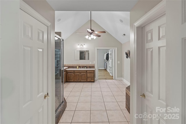 2006 Sandy Pond Ln, Waxhaw, NC 28173 - bathroom featuring vanity, tile patterned flooring, a ceiling fan, lofted ceiling, and a shower with door