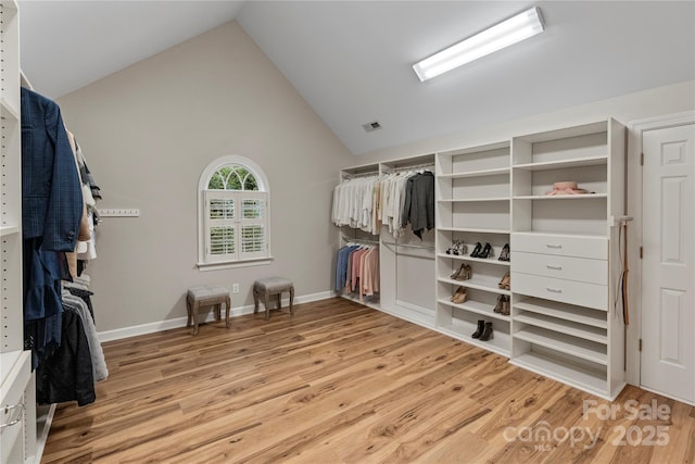 2006 Sandy Pond Ln, Waxhaw, NC 28173 - walk in closet with light wood finished floors and lofted ceiling