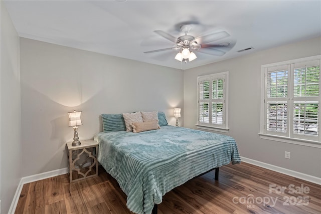 2006 Sandy Pond Ln, Waxhaw, NC 28173 - bedroom with baseboards, multiple windows, and wood finished floors