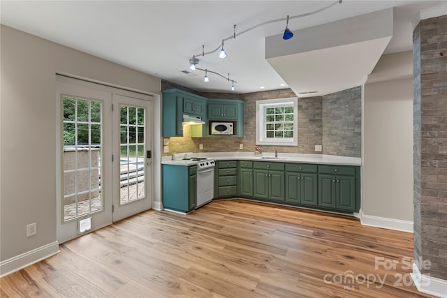 2006 Sandy Pond Ln, Waxhaw, NC 28173 - kitchen with green cabinets, white appliances, a sink, under cabinet range hood, and light wood-style flooring