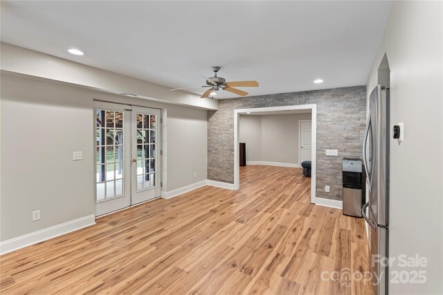 2006 Sandy Pond Ln, Waxhaw, NC 28173 - unfurnished living room featuring ceiling fan, baseboards, light wood-style flooring, recessed lighting, and french doors