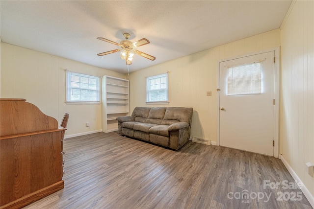 5840 Potter Rd, Matthews, NC 28104 - living room with wood finished floors, a ceiling fan, and baseboards