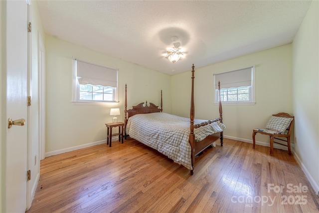5840 Potter Rd, Matthews, NC 28104 - bedroom featuring light wood-style flooring and baseboards