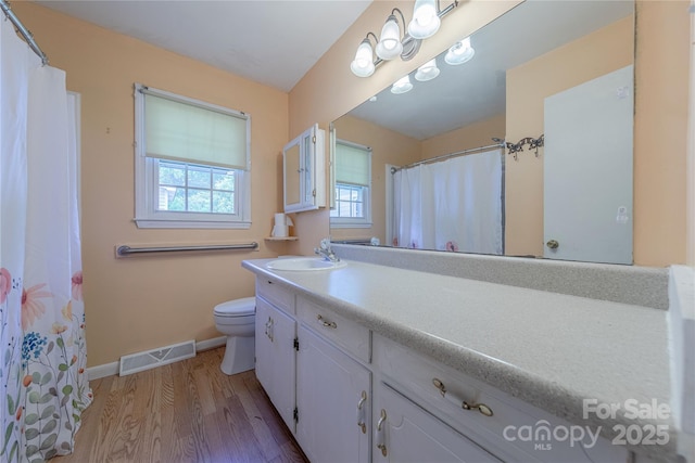 5840 Potter Rd, Matthews, NC 28104 - bathroom with baseboards, vanity, toilet, wood finished floors, and curtained shower