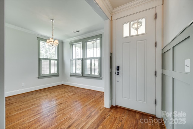 750 Waterscape Ct, Rock Hill, SC 29730 - foyer featuring a chandelier, ornamental molding, light wood-style flooring, and baseboards