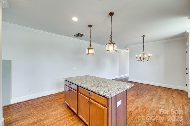 750 Waterscape Ct, Rock Hill, SC 29730 - kitchen featuring crown molding, light wood-style floors, baseboards, decorative light fixtures, and a chandelier
