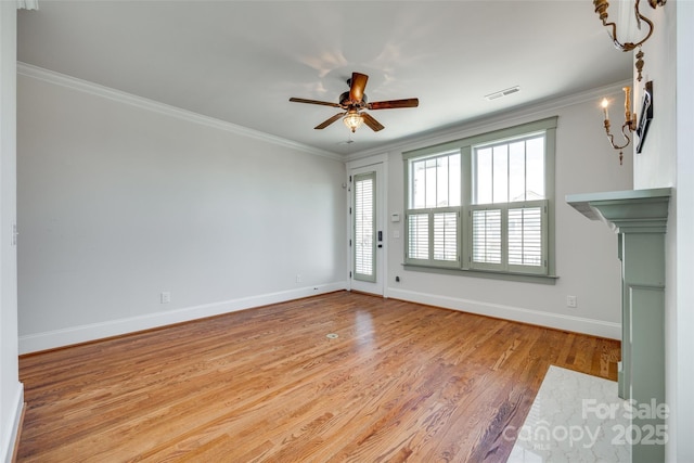 750 Waterscape Ct, Rock Hill, SC 29730 - unfurnished living room with ornamental molding, baseboards, wood finished floors, a ceiling fan, and a chandelier