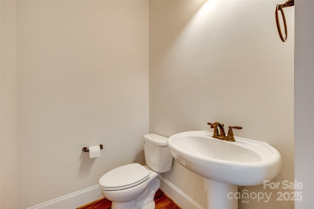 750 Waterscape Ct, Rock Hill, SC 29730 - half bath with toilet, baseboards, wood finished floors, and a sink