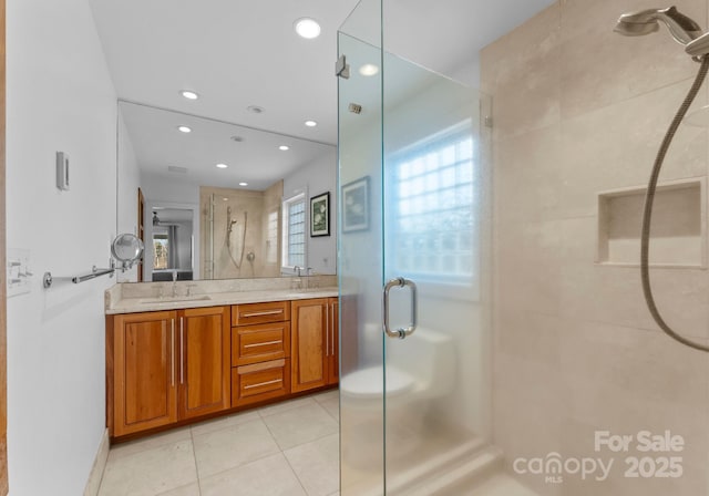 5153 Glenwood St, Sherrills Ford, NC 28673 - bathroom featuring a shower stall, healthy amount of natural light, double vanity, tile patterned flooring, and recessed lighting