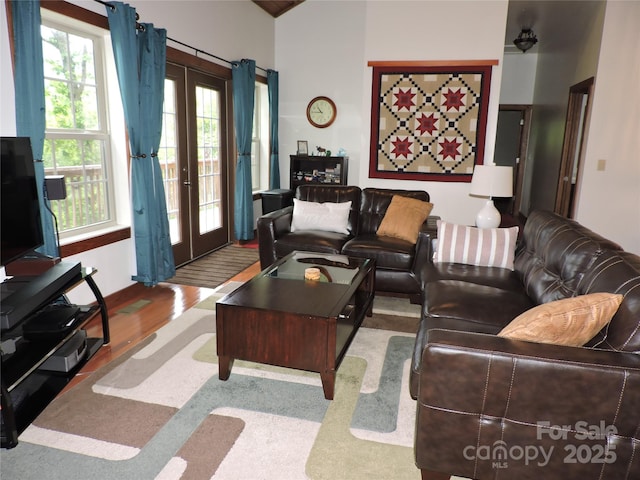 235 Red Oak Ln, Burnsville, NC 28714 - living room with french doors, plenty of natural light, and wood finished floors