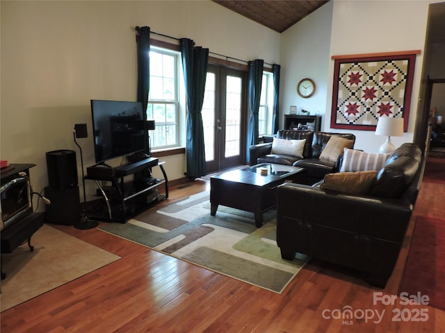 235 Red Oak Ln, Burnsville, NC 28714 - living area with wood finished floors, vaulted ceiling, a wood stove, and wooden ceiling