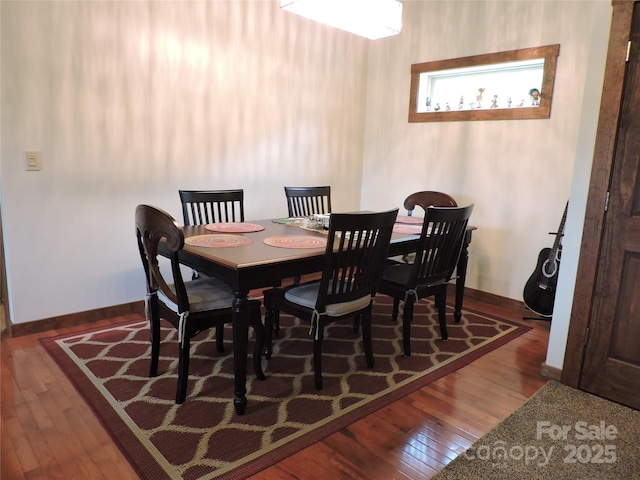 235 Red Oak Ln, Burnsville, NC 28714 - dining area with hardwood / wood-style flooring and baseboards