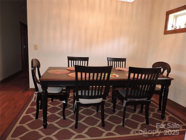 235 Red Oak Ln, Burnsville, NC 28714 - dining space with wood finished floors and baseboards