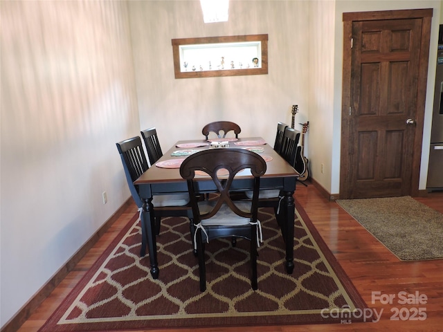 235 Red Oak Ln, Burnsville, NC 28714 - dining area featuring wood finished floors and baseboards
