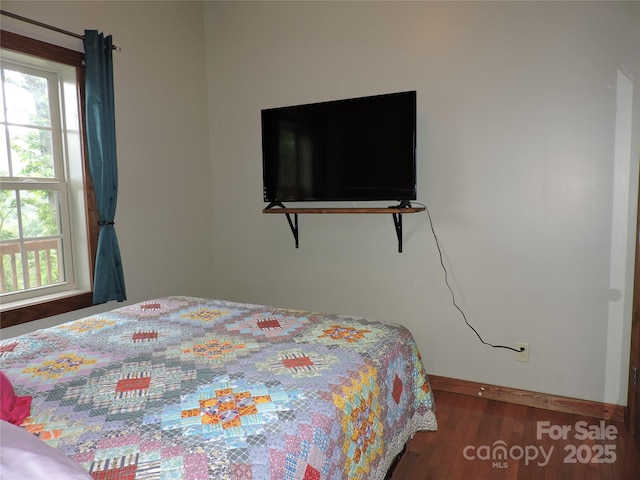 235 Red Oak Ln, Burnsville, NC 28714 - bedroom with baseboards and wood finished floors
