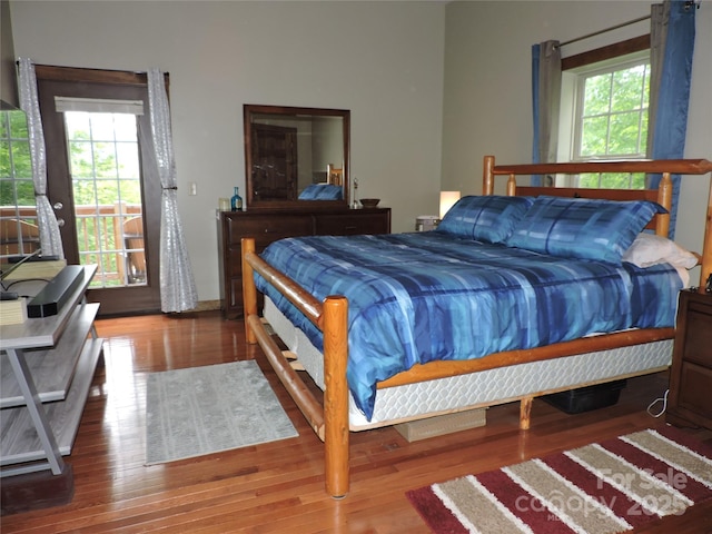 235 Red Oak Ln, Burnsville, NC 28714 - bedroom with access to exterior and wood finished floors